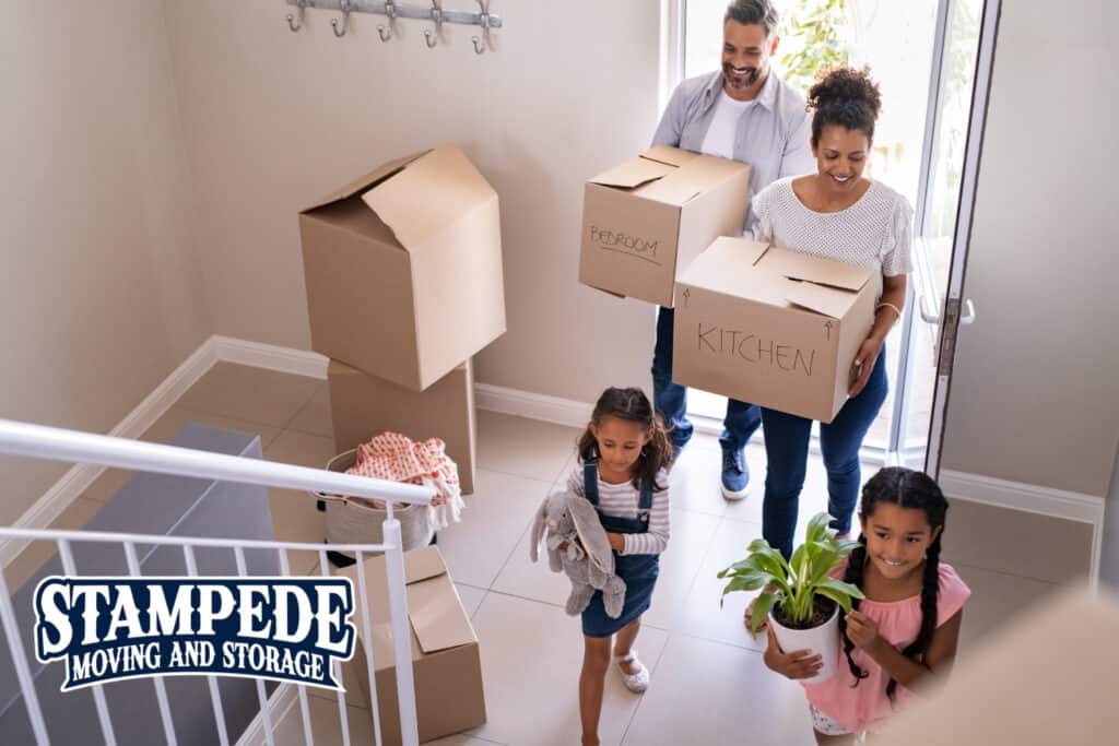 Family moving into new home with boxes