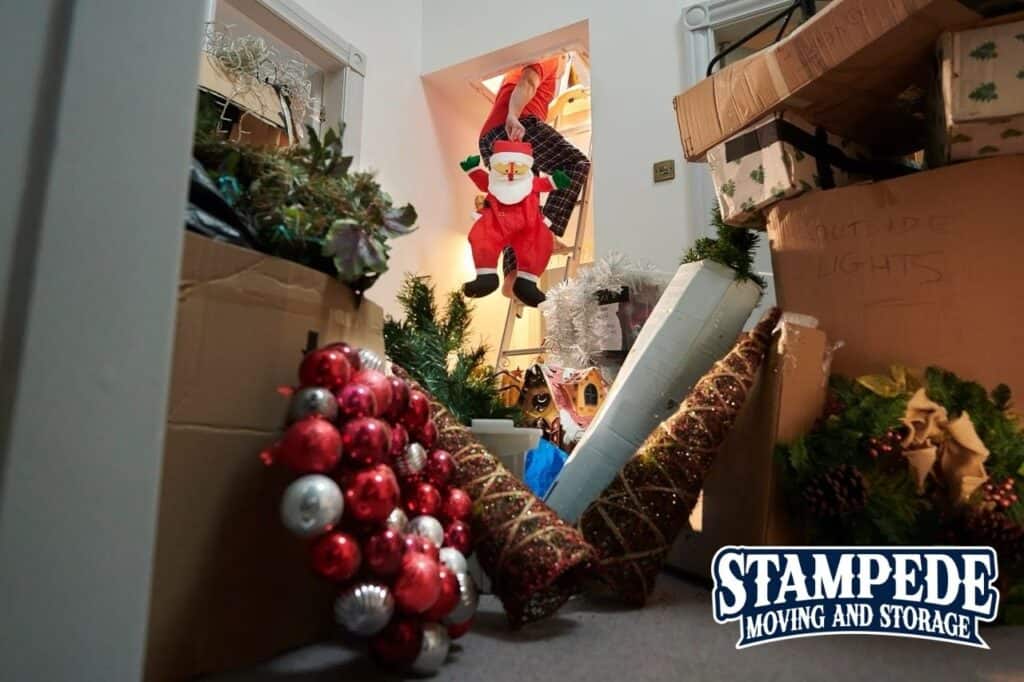 Holiday decorations stored in attic with Santa figure.